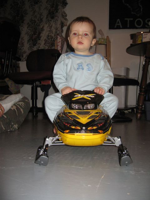 Sitting on the R/C MXZ. He wants to be just like his Dad!